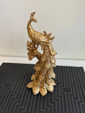 golden peacock sculpture