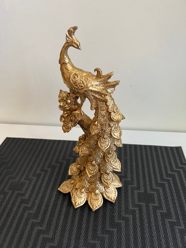 golden peacock sculpture